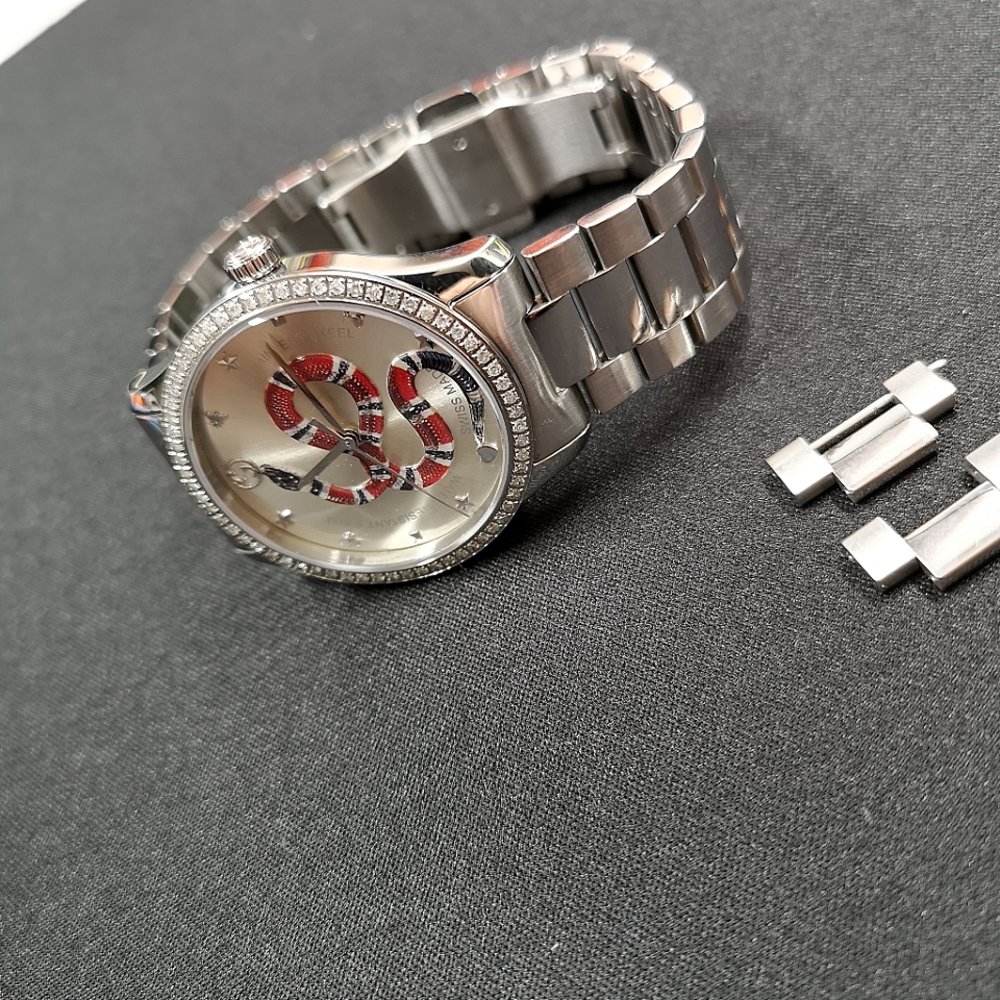 Gucci snake motif diamond bezel watch